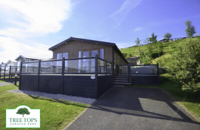 Sunseeker Sensation Lodge on award-winning Tree Tops Caravan Park, North Wales. 3 bedrooms. Large decking area. Sea views. Central Heating. Double Glazing.