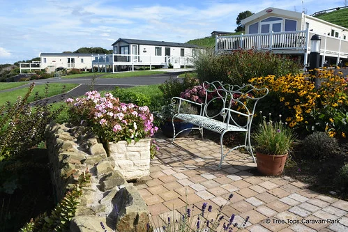 The views from Tree Tops Caravan Park, as well as the landscaped gardens, are truly spectacular!😍That's why we have lots of benches and seating areas around the Park for you to enjoy them from!Perch on the hillside of Ynys Hir or Parc Newydd and look out to the Dee Estuary and Irish Sea🌊, relax in the tranquillity of the Japanese Garden, or enjoy a picnic lunch🥪 while you keep an eye on your little ones as they tire themselves in the play area!Website 🔗 link in bio @treetopscp#TreeTopsCaravanPark #AwardWinningGardens #FabulousViews #GorgeousGardens #SeaViews #CaravanParkInNorthWales
