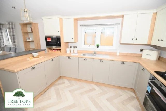 ⭐ Willerby Portland Lodge for sale at Tree Tops Caravan Park in North Wales! ⭐Soft and cosy colours and furnishings give the gorgeous NEW Willerby Portland lodge a real homely feel. 😃See more on our website - 🔗link in bio @treetopscp🌳PRICE: £110,000⭐HIGHLIGHTS:
✔Wraparound UPVC decking to be included
✔Large shaker-style kitchen with integrated appliances including a washer/dryer and dishwasher, and handy breakfast bar with 2 stools
✔Cosy lounge with 3-piece suite, footstool, wood burner-effect electric fire, and French doors to the front
✔Dining area with freestanding table and 4 chairs and Welsh dresser
✔Master bedroom with king-size bed, walk-in wardrobe, dressing table, loft access, and large ensuite with corner shower
✔Bedroom 2 with twin single beds, 2 wardrobes, dressing table, and loft access
✔Family bathroom with corner shower
✔Double glazing and central heating
✔40' x 16'
✔Lovely views across the Park to the Irish Sea beyond⭐If you'd like to book a viewing, call us on 01745 560279 or via our website!#treetopscaravanpark #northwalesholiday #staticcaravanforsale #holidaylodgeforsale  #willerbycaravans #willerbyholidayhomes #willerbyportlandlodge #absundecks