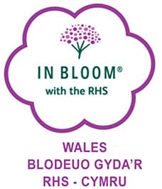 in bloom with Wales logo